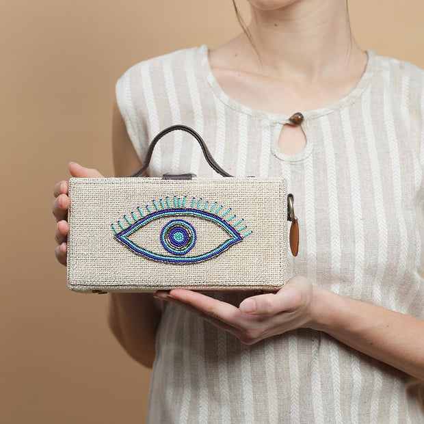 Evil eye hand embroidered jute clutch bag