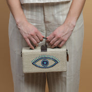 Evil eye hand embroidered jute clutch bag