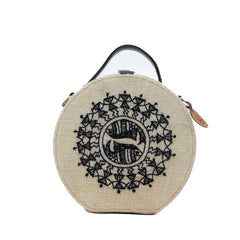 Warli Art hand embroidered round jute bag by gonecase