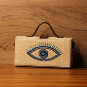 Evil eye hand embroidered jute clutch bag